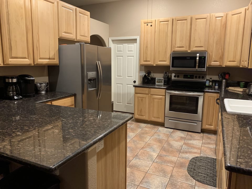 Kitchen with all upgraded appliances including dishwasher.