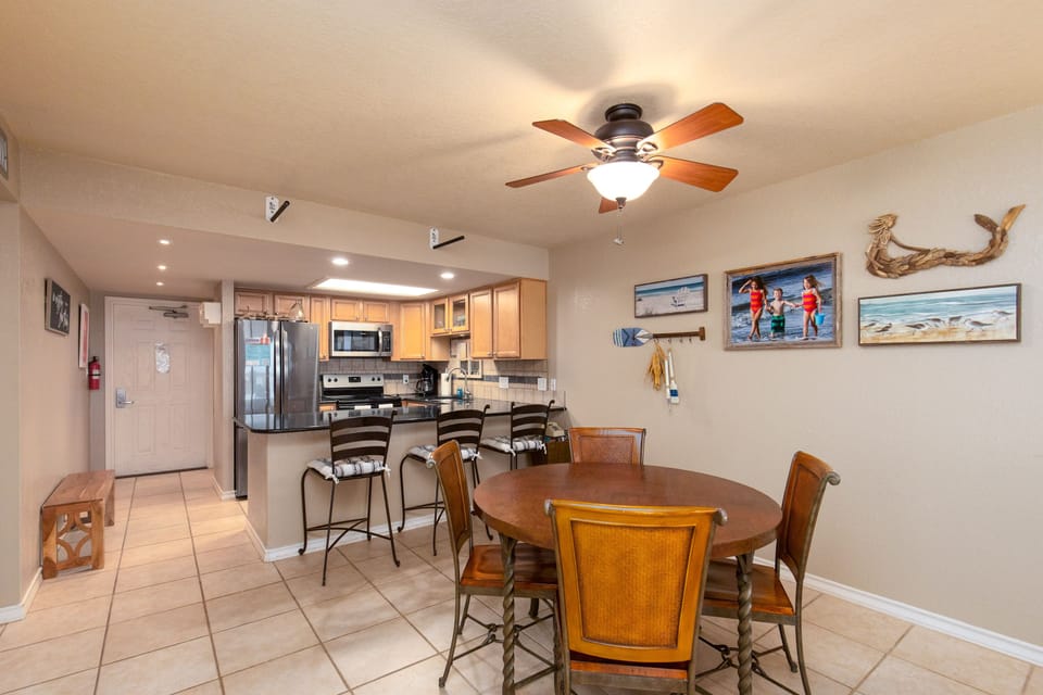 Gather around your spacious dining area with coastal charm, where the open kitchen design creates perfect flow for meal prep and conversation.