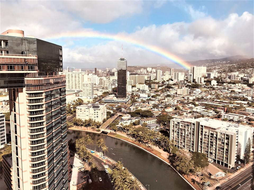 Rainbow view looking towards mountains from window.