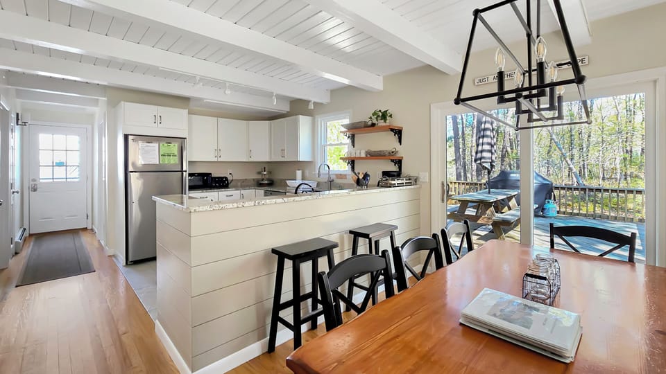 Dining area with kitchen beyond