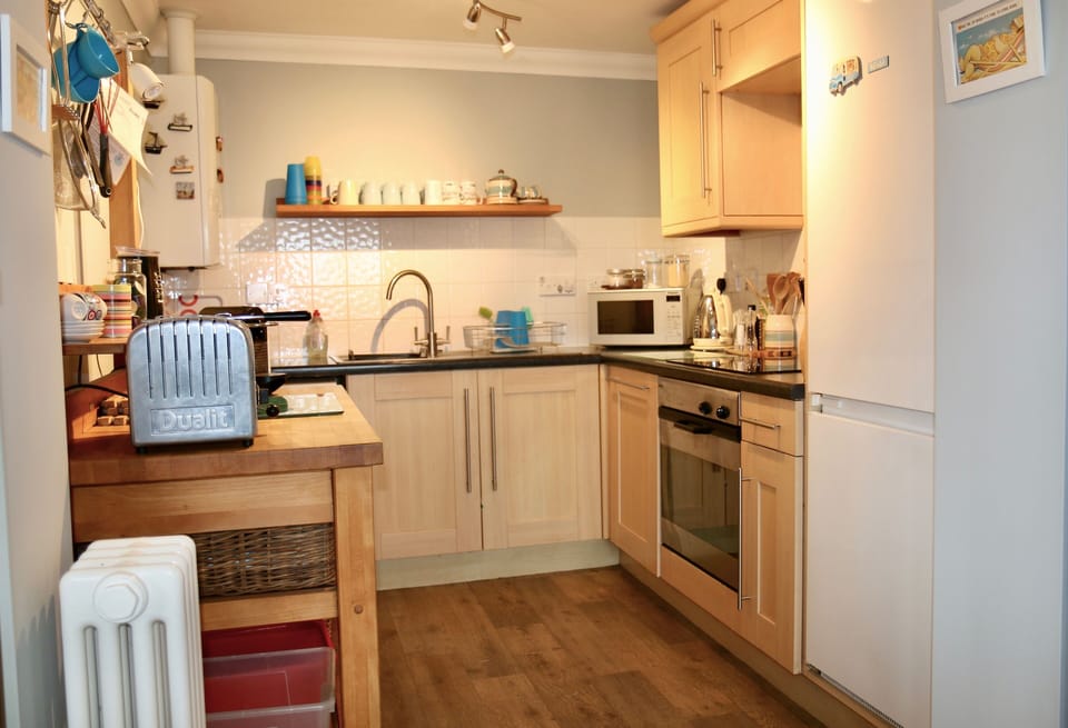 Contemporary, fully-equipped, fitted kitchen.