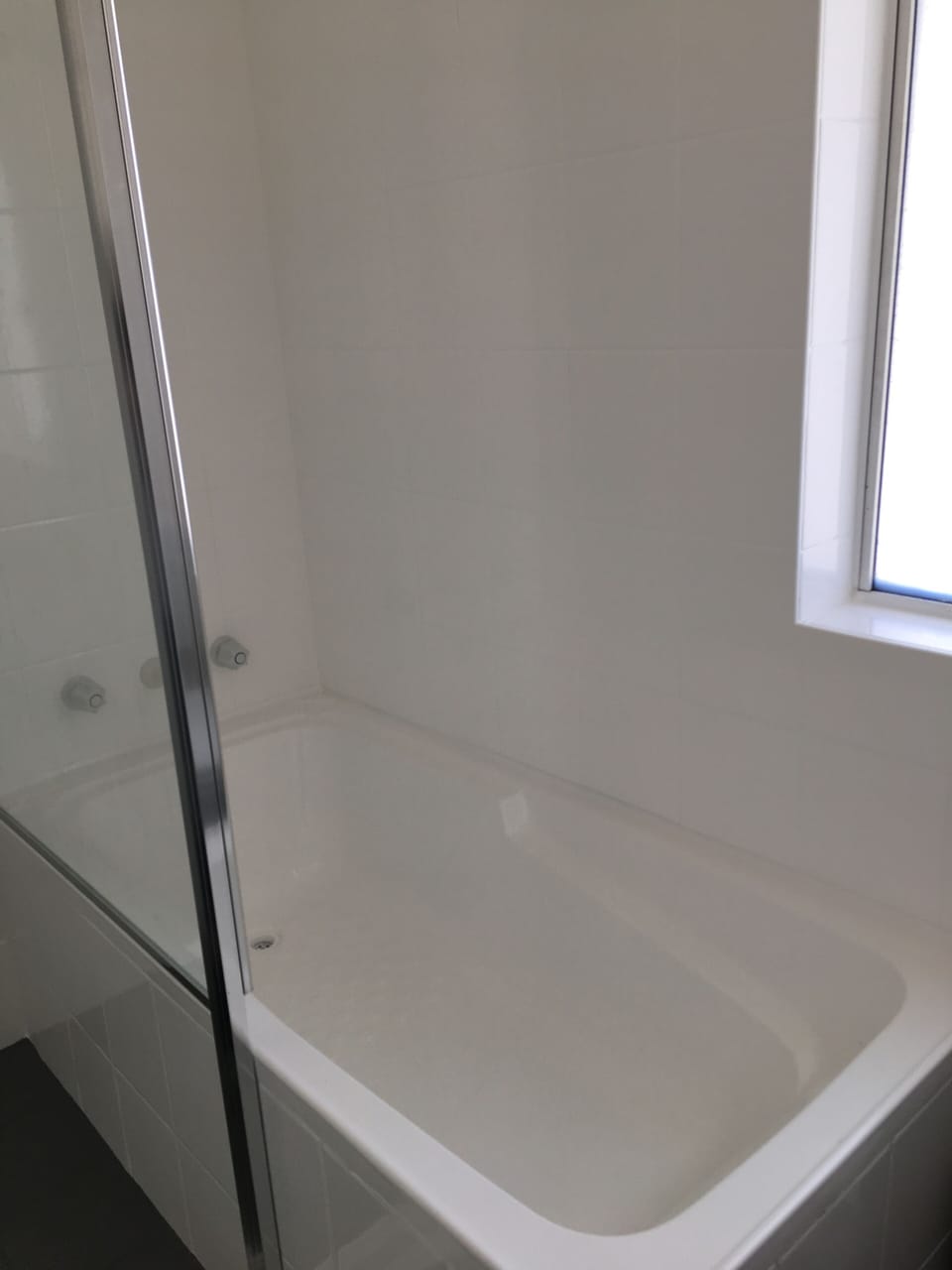 Bathroom has Separate shower and bathtub with toilet and vanity 
