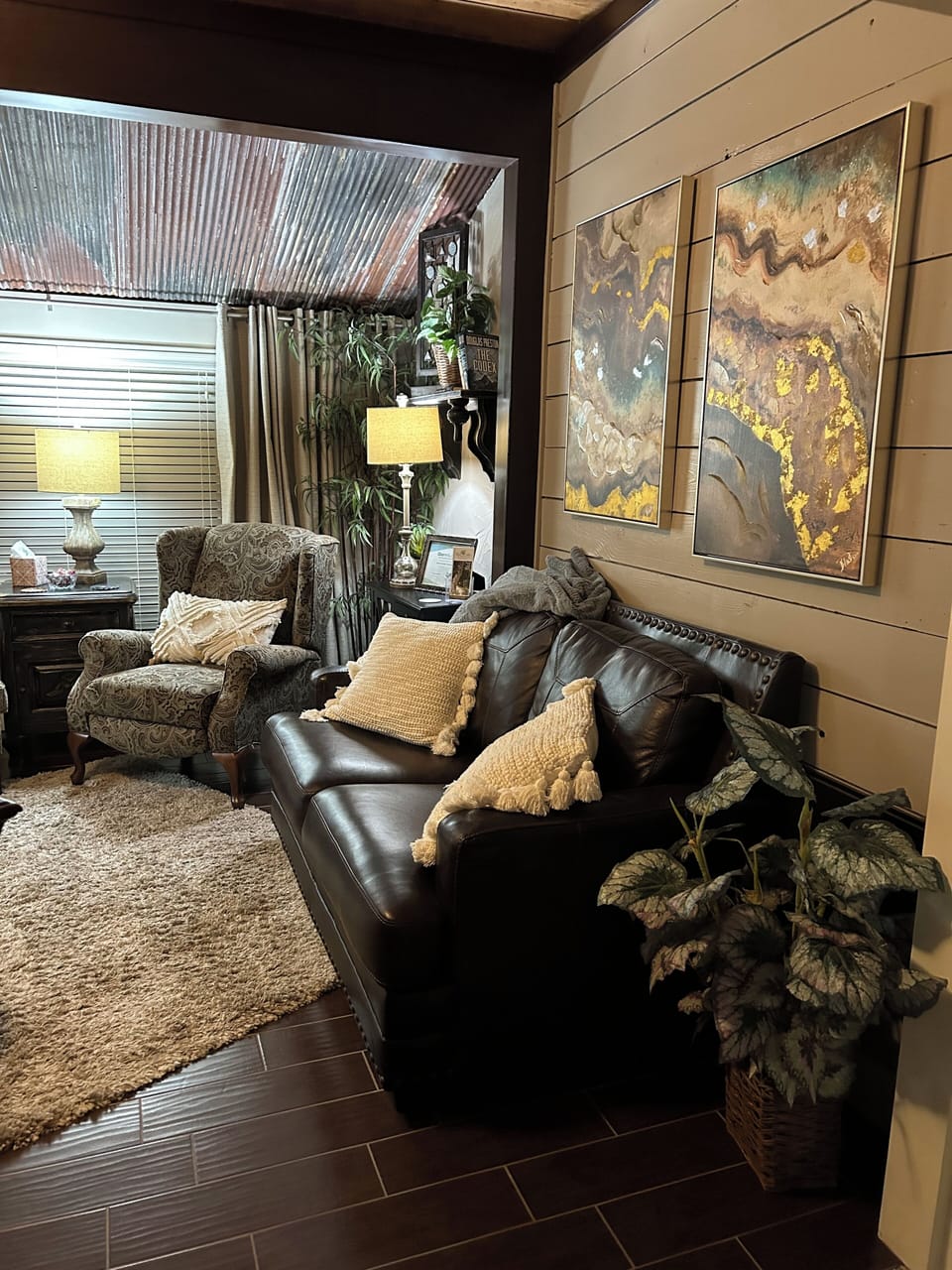 Sitting area with leather love seat, recliner, chair and foot stool