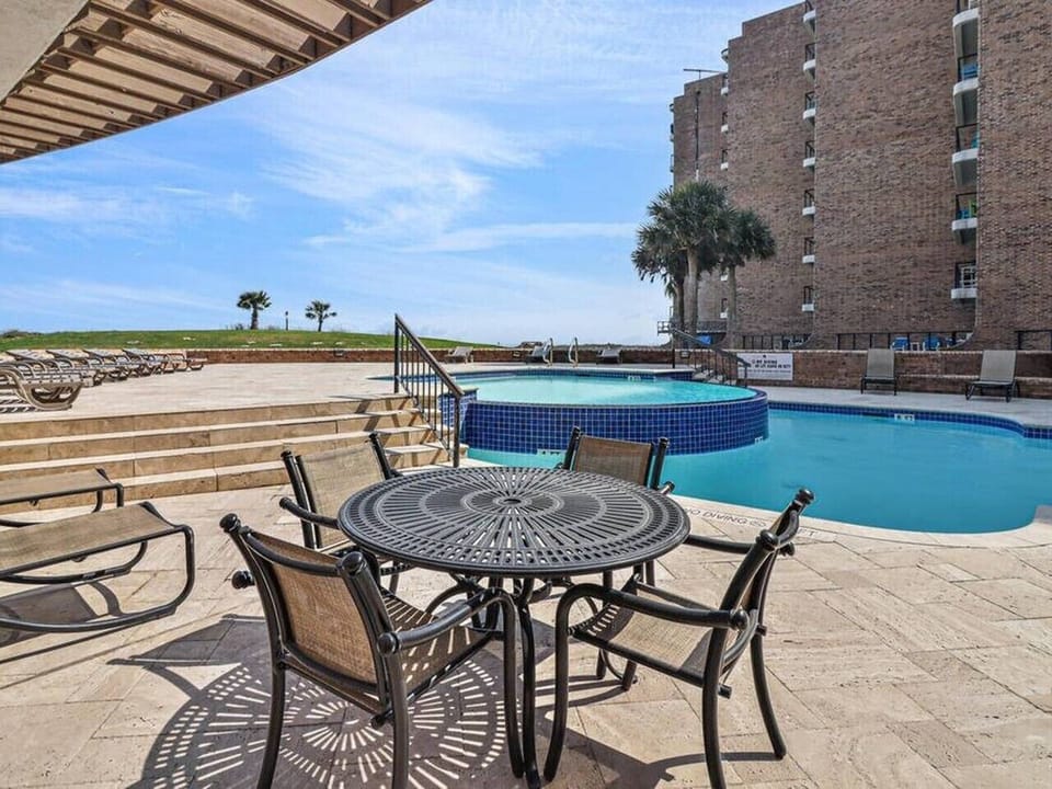 Resort-Style Cascading Pool with Spacious Sun Deck