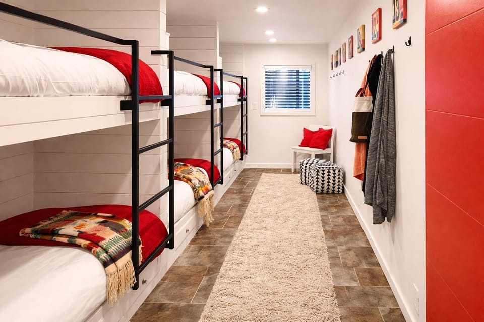 Cozy bunk room with vibrant accents and ample storage