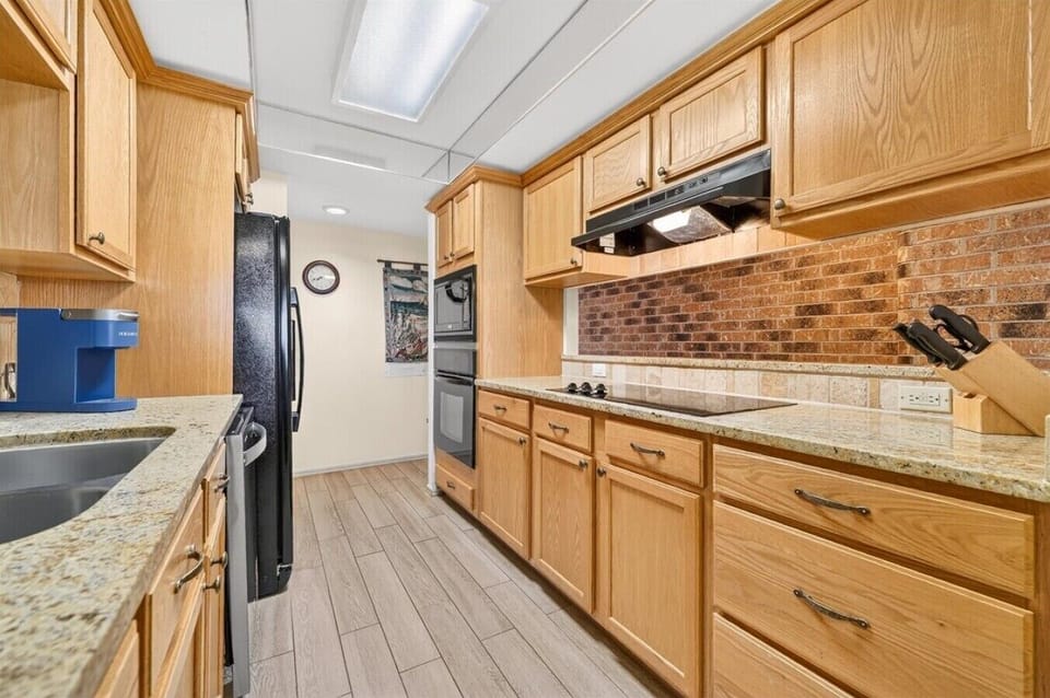 Fully Equipped Galley Kitchen with Granite Countertops