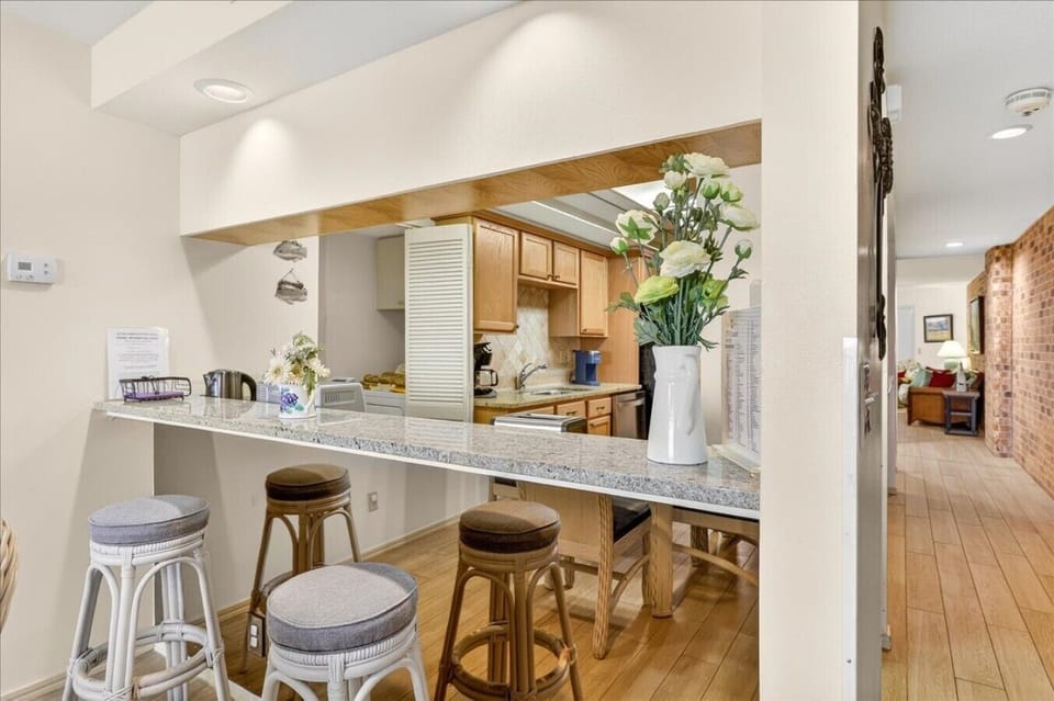 Breakfast Bar with Seating for Two and Pass-Through to the Kitchen
