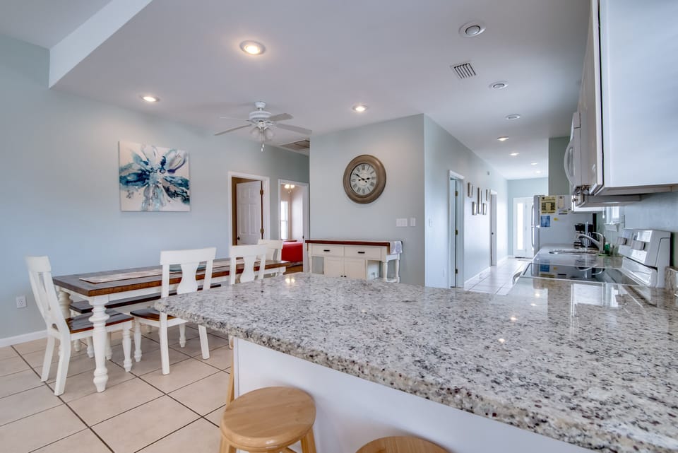 Kitchen - Additional seating is offered at the bar in the kitchen for convenience.