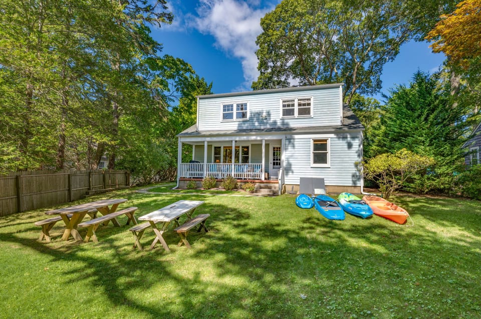 Backyard with Picnic Tables and 3 Adult Kayaks and 1 Child Kayak
