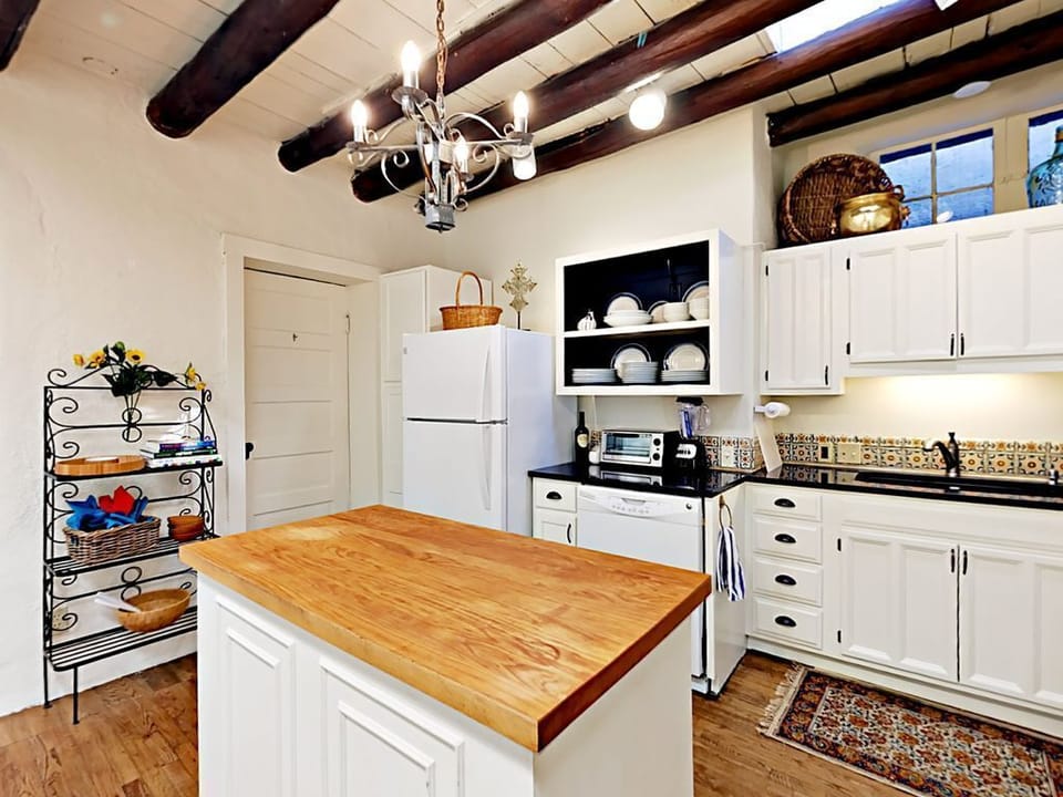 The well-equipped kitchen includes a starter supply of paper towels and dish soa