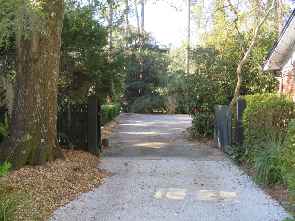 Drive down the driveway and through the gate.