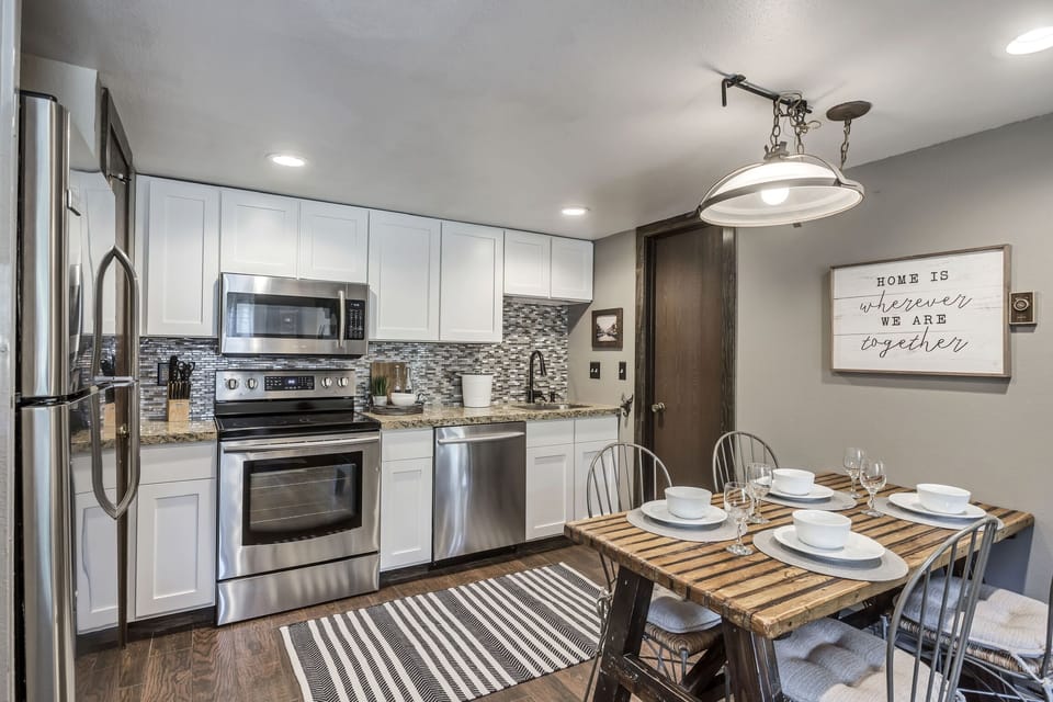 Kitchen with seating for 6 at table.