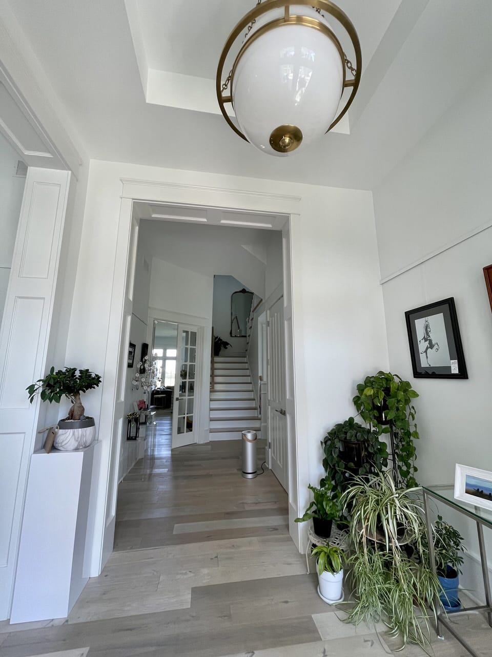 Front foyer leading to stairs for guests rooms. Molekule air purifiers