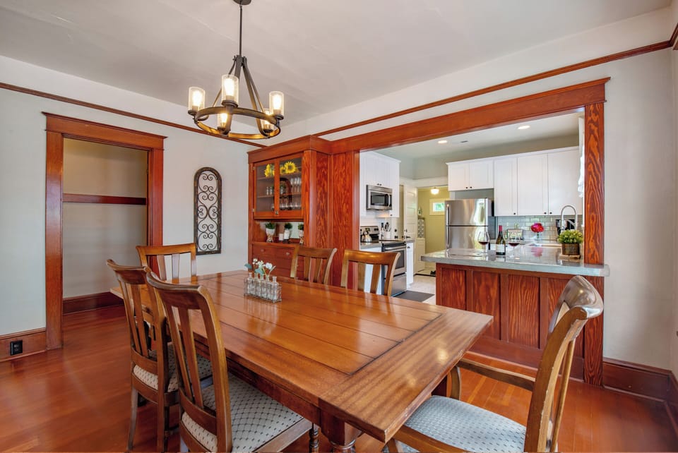 Dining Open to Kitchen | Table seats 6 | Hall Leads to the 2 Bedrooms on Opposite Sides of House for Privacy