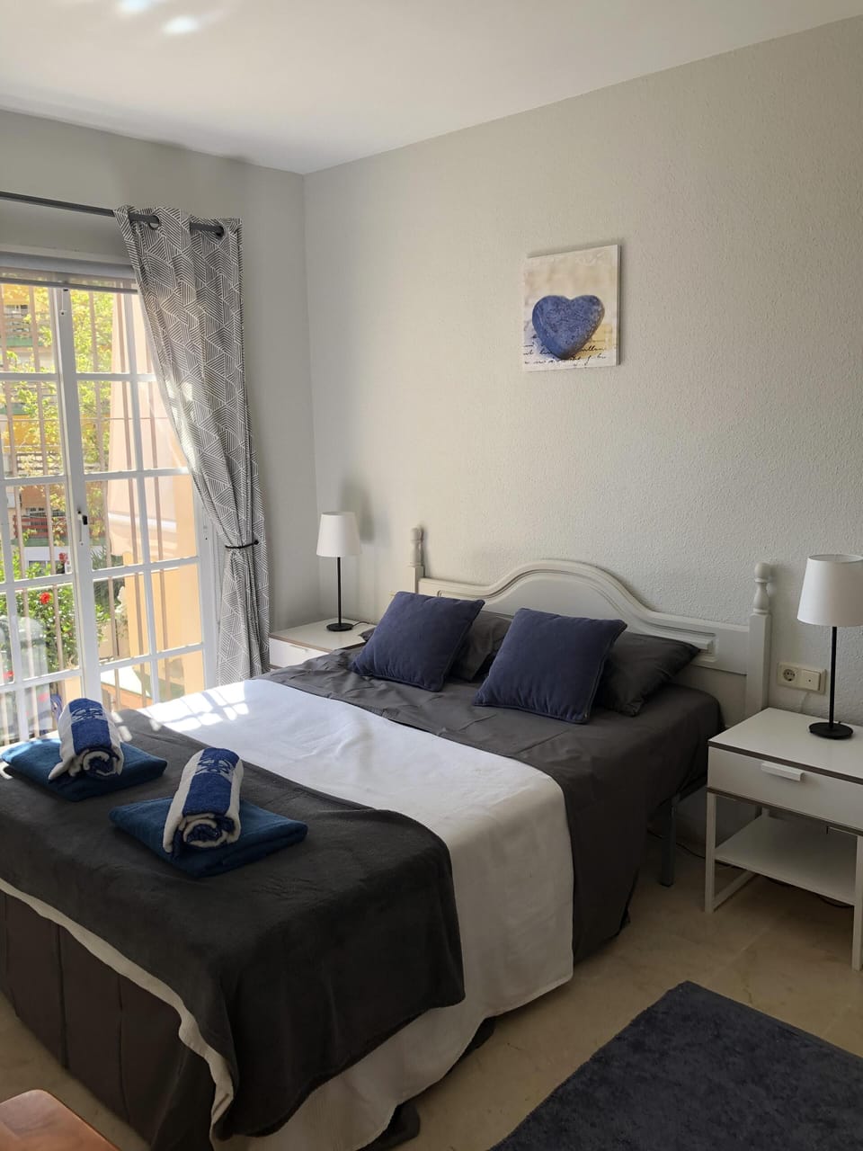Double bedroom with fitted  wardrobe drawers and air con unit 