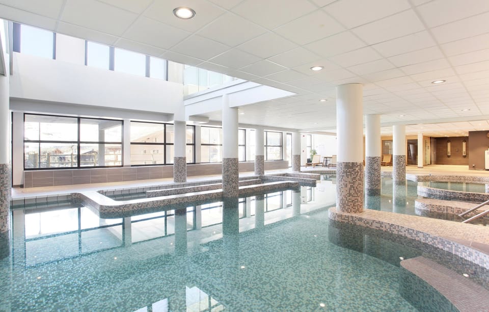 The swimming area at the nearby spa has a fun modern design