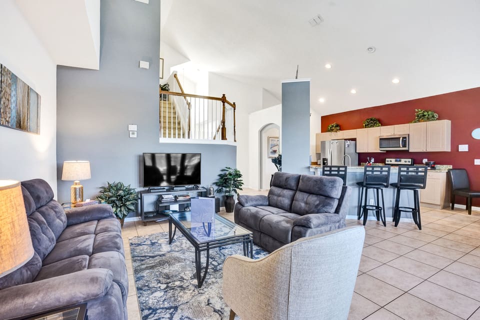 Spacious open floor plan connects kitchen, living, and dining areas