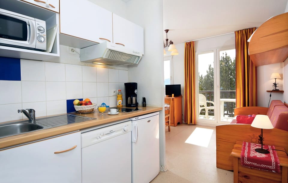 Tuck into a snack you’ve prepared in your kitchenette.