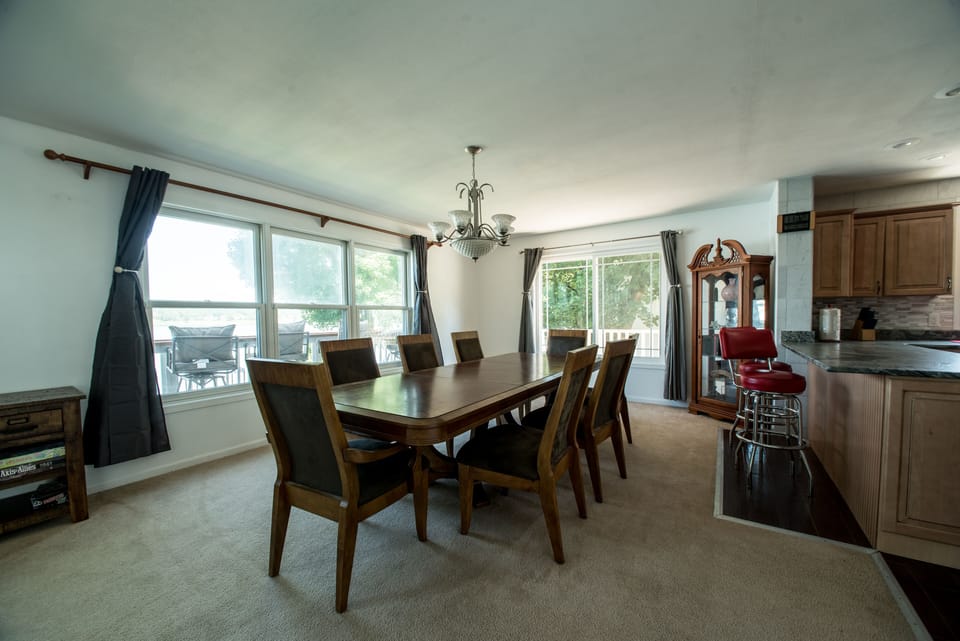 Dinning Area with balcony in background overlooking lake