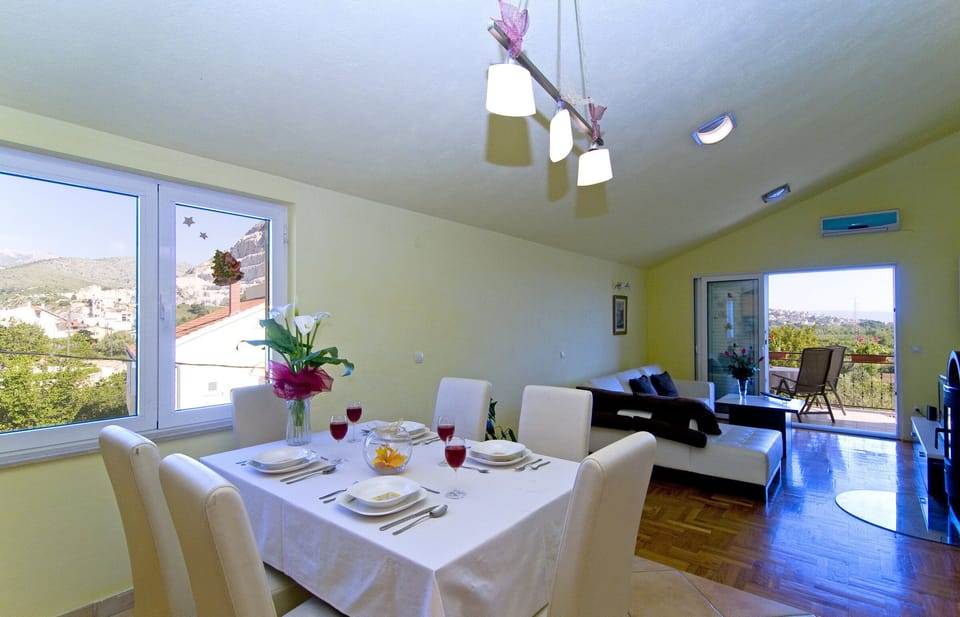 The kitchen is combined with living room and balcony.