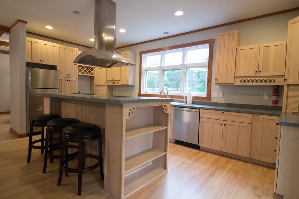 Large kitchen with new refrigerator and dishwasher.