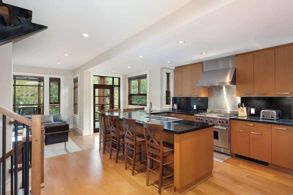 - Chef’s kitchen with granite countertops and high-end stainless appliances  
- Spacious island with bar seating for casual dining and social moments  
- Open layout connecting to living area for seamless entertaining 