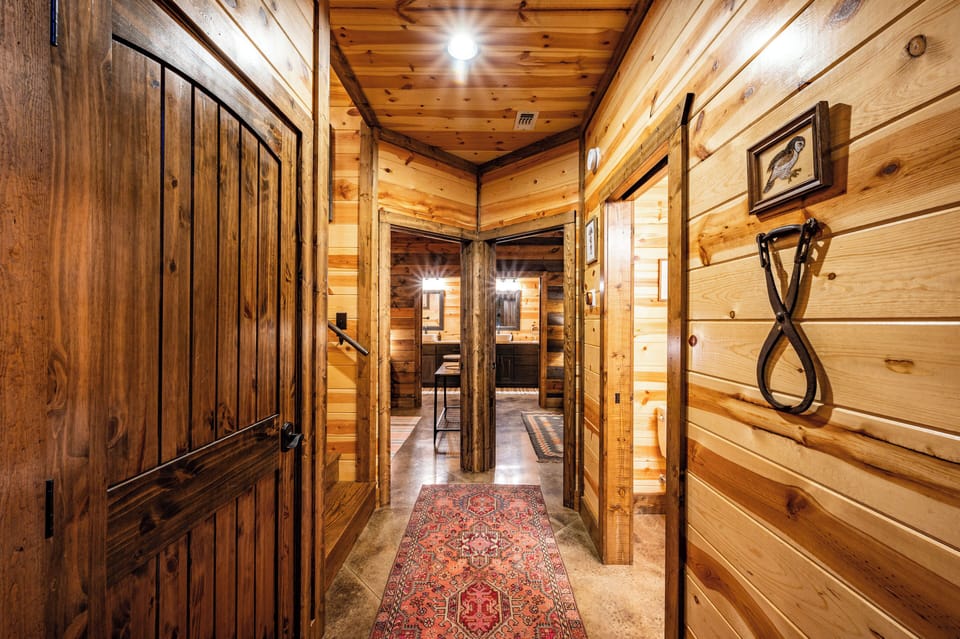 Hallway To Dual Grand Suites Including Half Bath Immediately To Right
