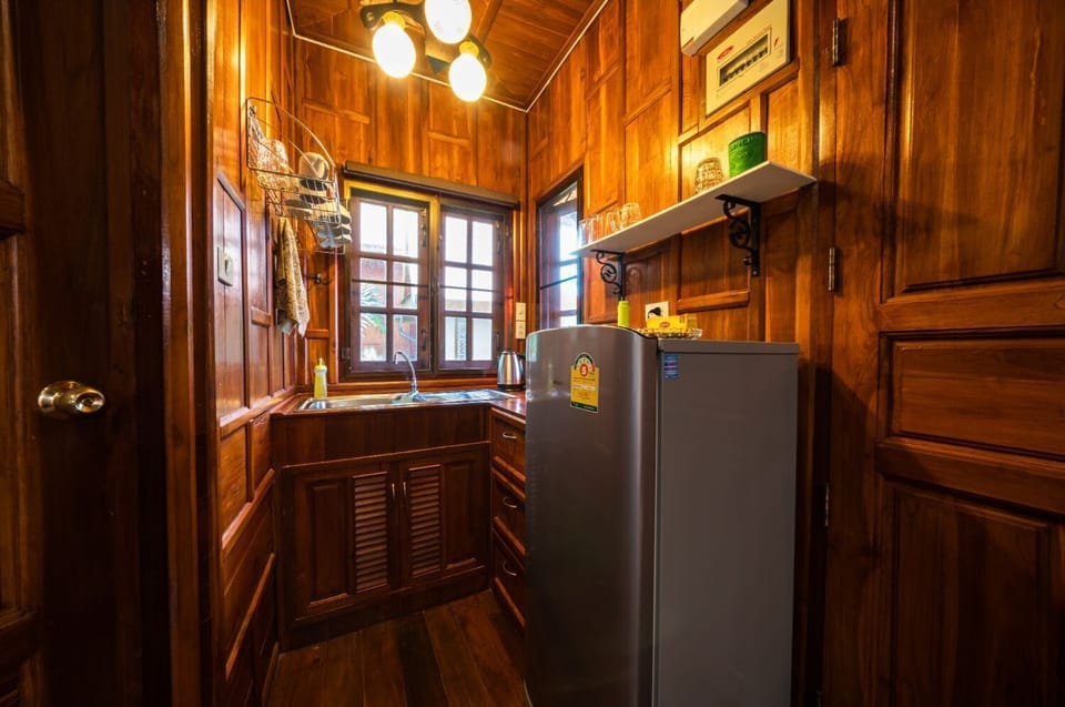 The kitchenette on the 2nd floor, next to the living room.