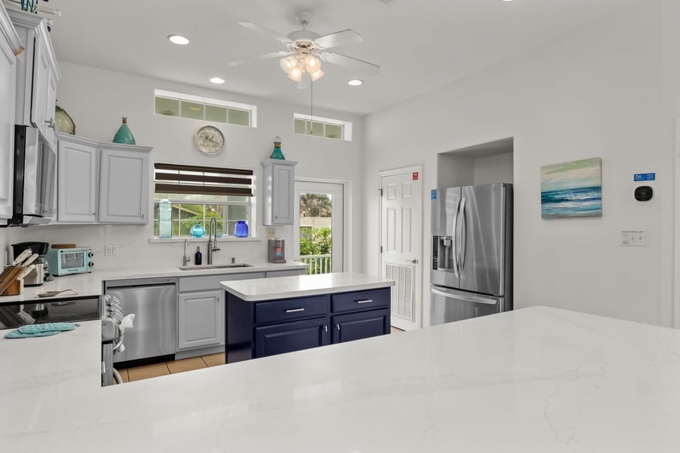 Kitchen has access to the 2nd floor balcony that overlooks the pool.