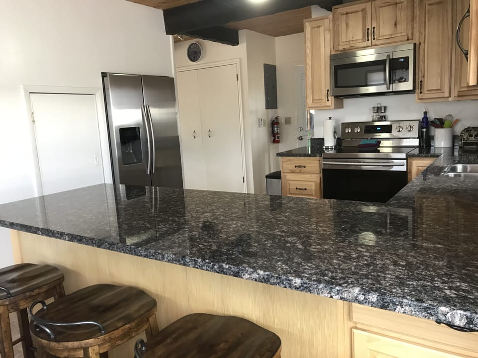 Full fridge with ice and water dispenser. 
