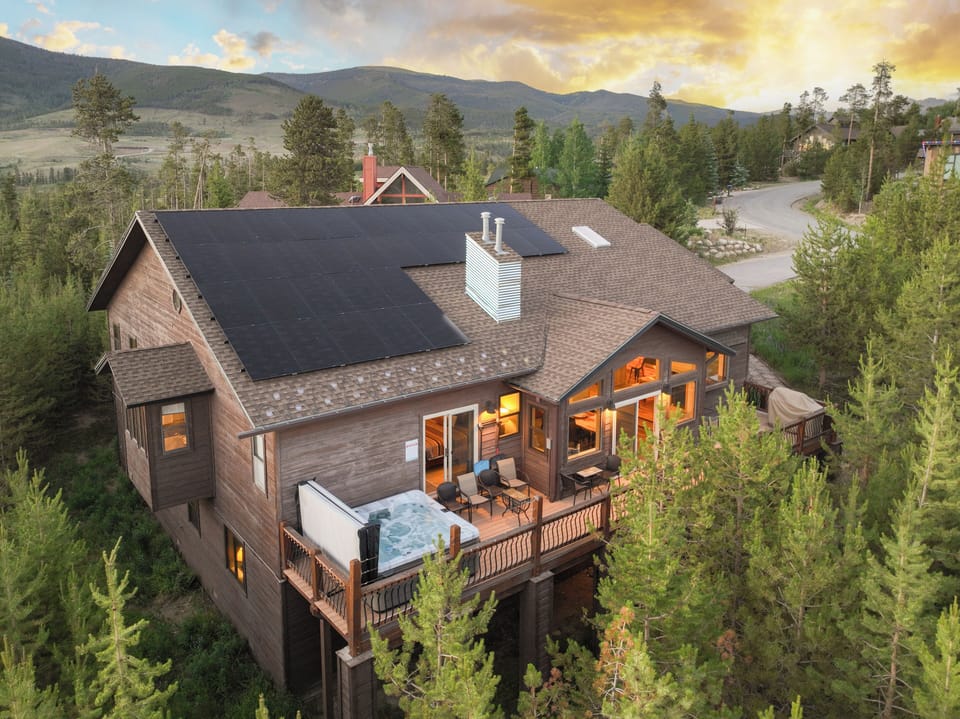 Large deck with hot tub, gas grill, plenty of seating and spectacular views