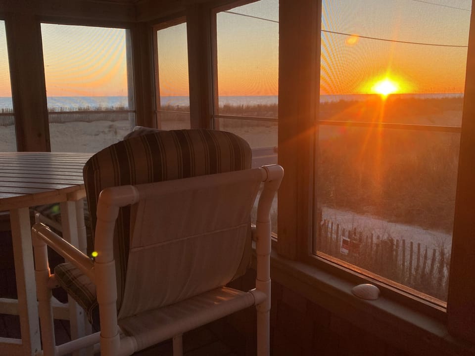 Enjoy those glorious OBX sunrises from the screened in sun porch.