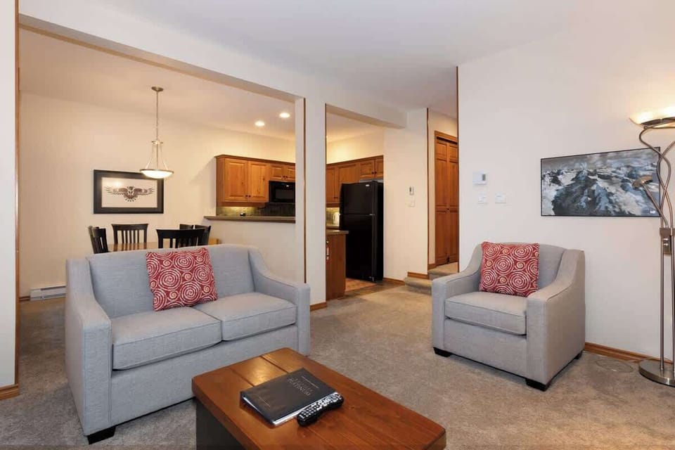 - Comfortable open-plan living with easy flow from kitchen to lounge  
- Plush seating and mountain-inspired decor create a welcoming space  
- Ideal for relaxing evenings in your Whistler vacation home  