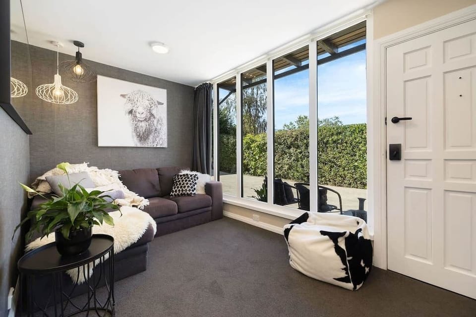 Studio living area with Lake Wakatipu views at Walk to Town 41B Alpine Chalet Queenstown