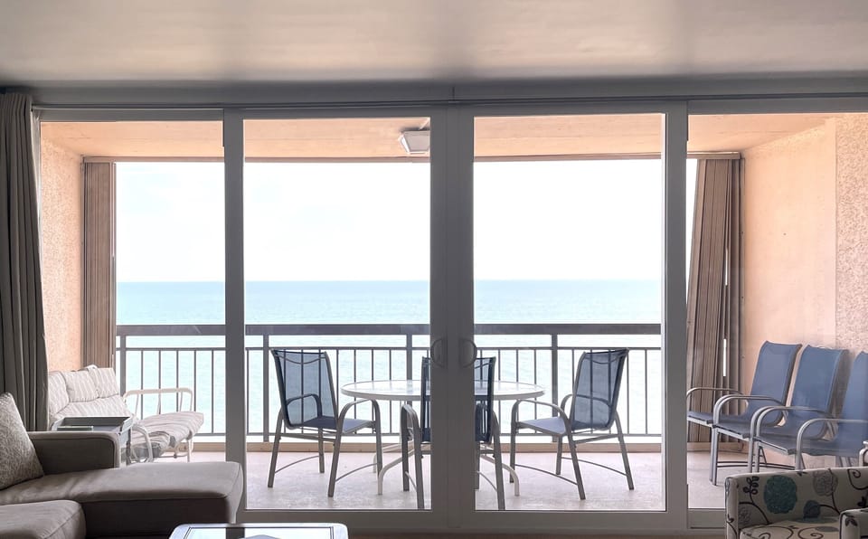 Ocean view for miles on a large balcony with seating for 6