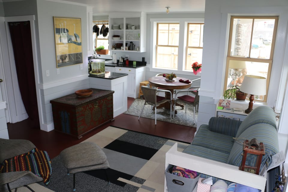 living room looking to dining area and kitchen