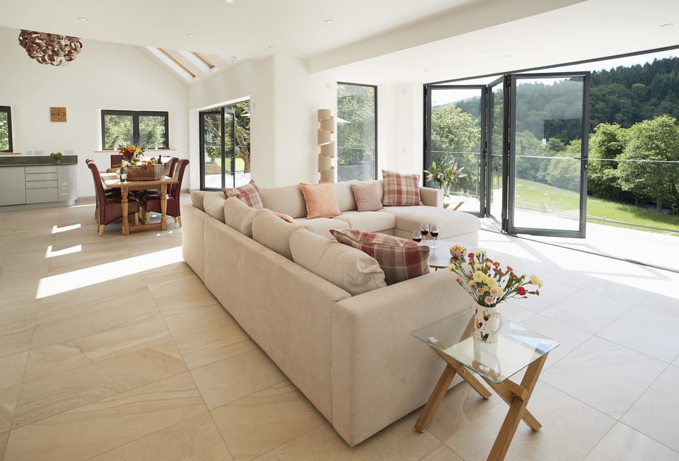 Ground floor: The spacious open-plan sitting room with beautiful oak dining table