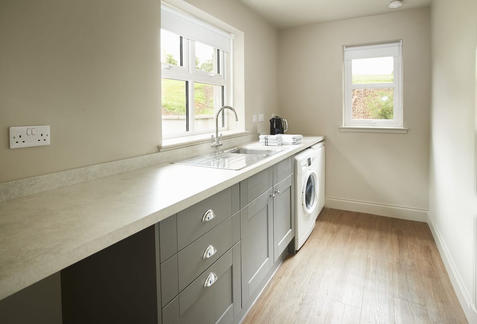 Ground floor: Utility room with washing machine and tumble dryer