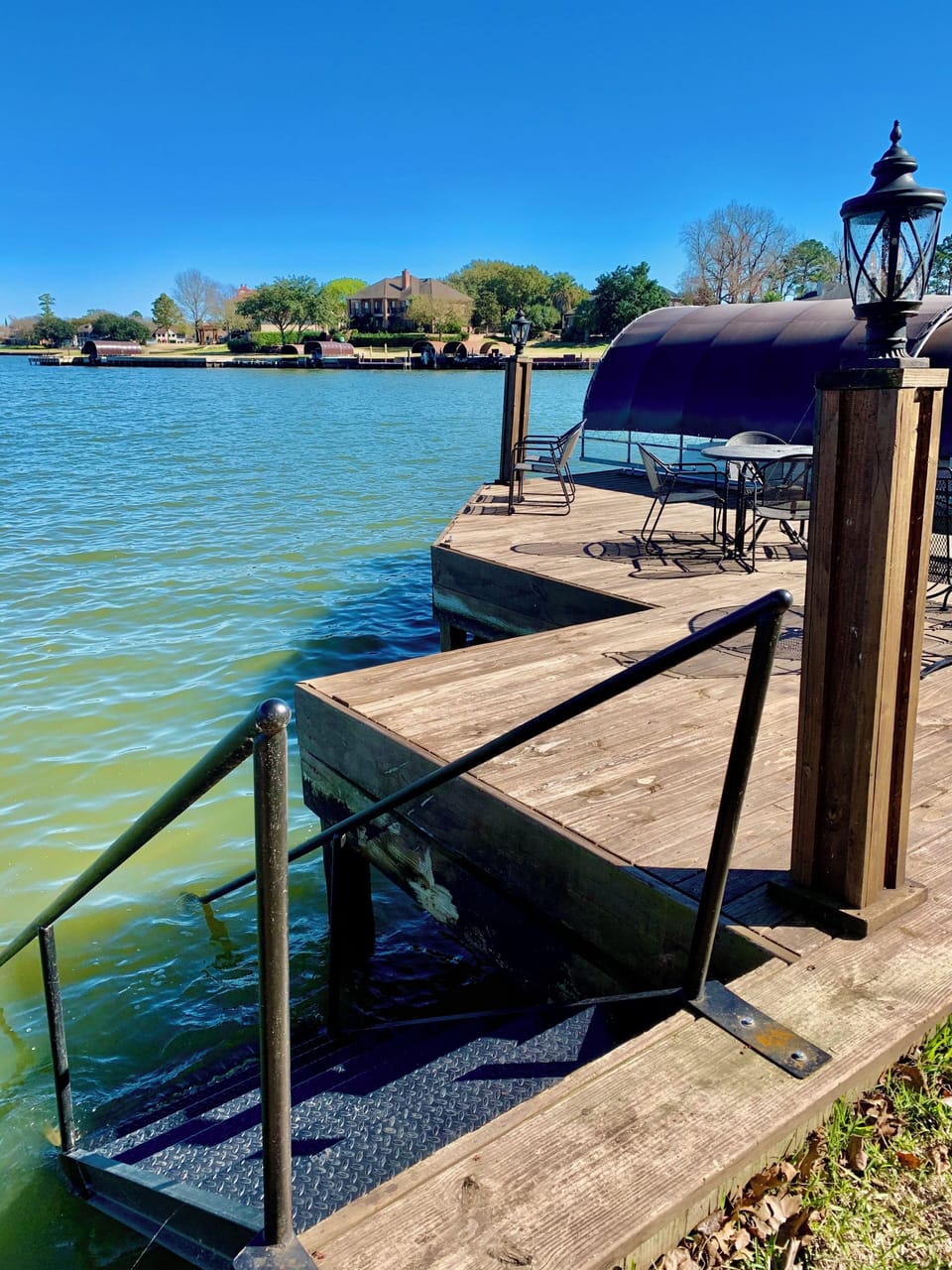 Fishing dock & covered boat lift.  Stairs directly down into the lake!