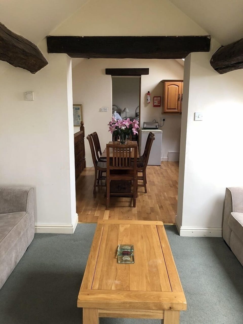 sitting room leading to kitchen and bedroom