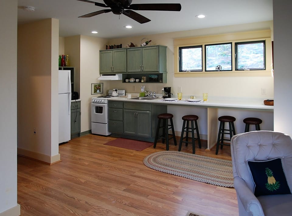 kitchen with stove, dishes, fullsize refrigerator,coffeemaker and toaster, micro
