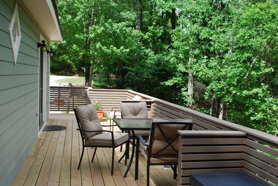 deck leading to entrance with available umbrella for outside dining