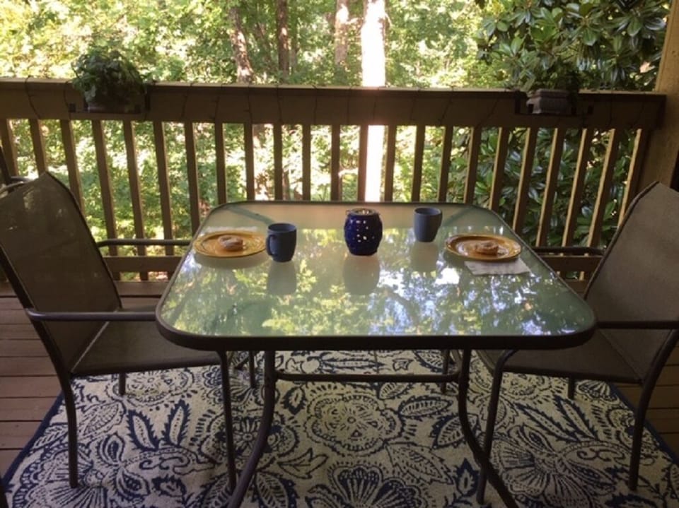 Sit and enjoy the serenity on the deck. There is one table and 4 chairs.