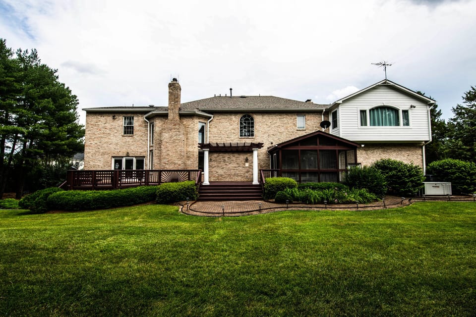 Spacious Deck w/ Covered Patio connects to garage & interior entertainment room 