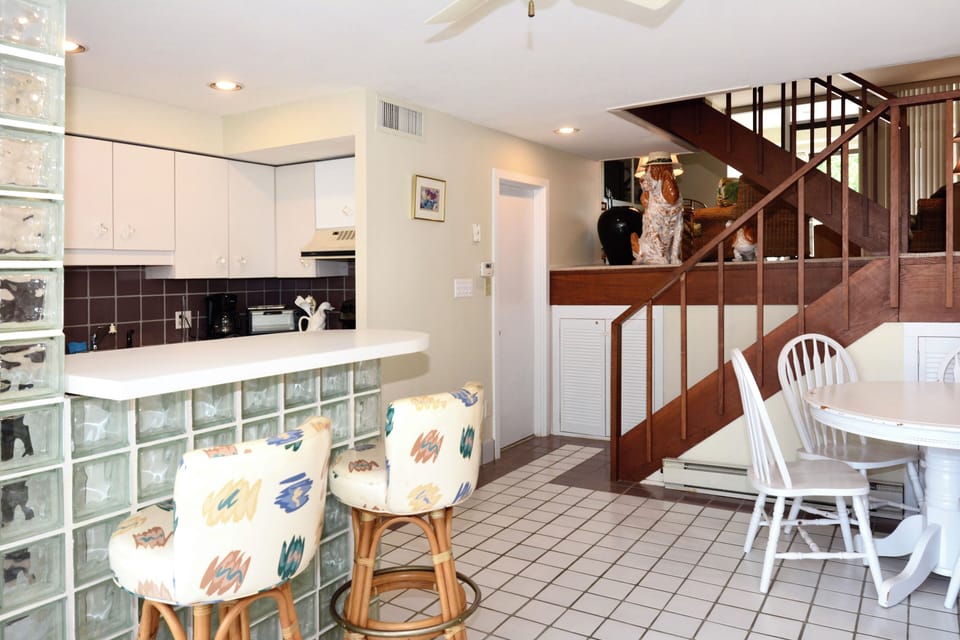 Up the steps to the livingroom! Door to half bath off kitchen
