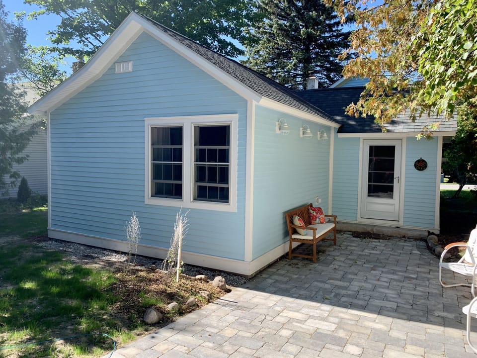 East side entrance patio into vestibule/mudroom space