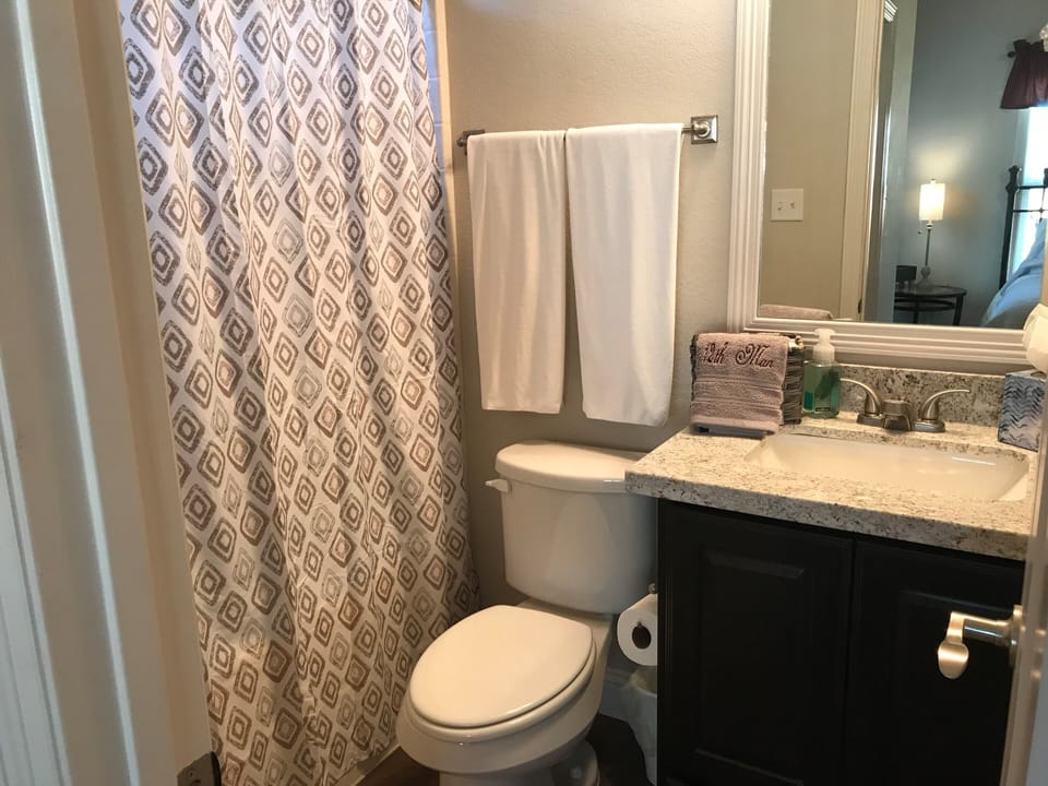 Bedroom 1 full bath with granite counter