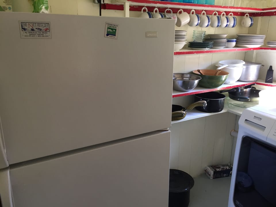 pantry with fridge and Maytag washer