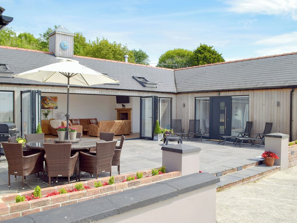 Large patio area with outdoor furniture | Manor Lodge Stables, Wiston, near Haverfordwest