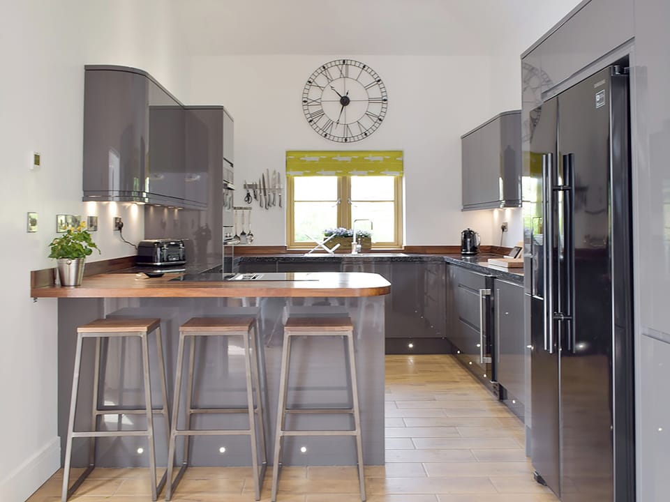 Well-equipped kitchen with breakfast bar | Manor Lodge Stables, Wiston, near Haverfordwest